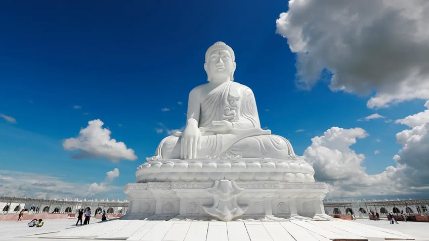 burmas military government unveils giant sitting buddha statue amid ongoing civil war and turmoil