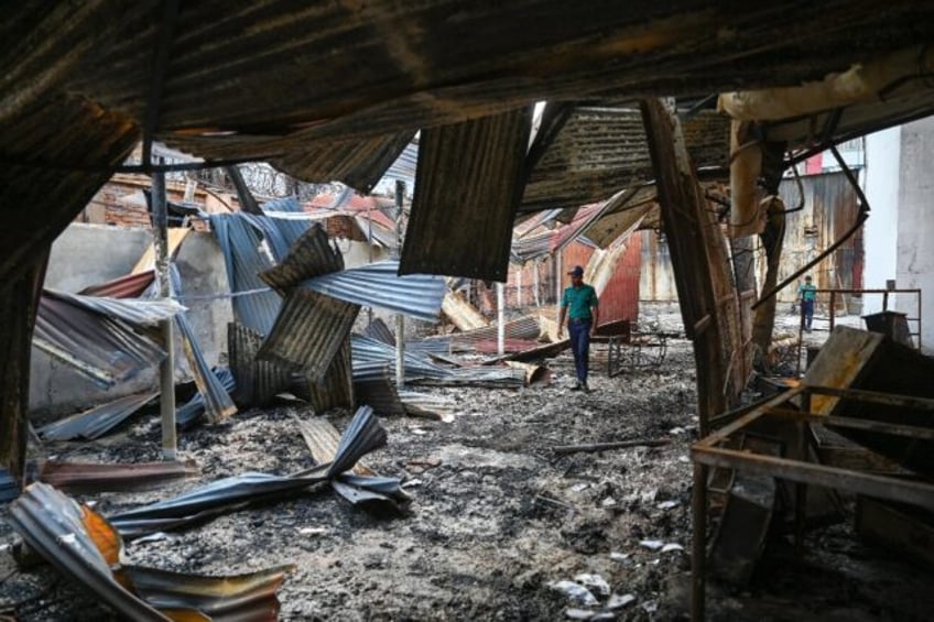 The charred remains of state broadcaster Bangladesh Television after students set it on fi