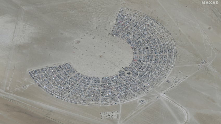 burning man festival told to shelter in place conserve food and water amid flooding