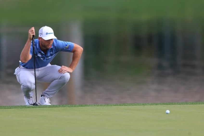 American Sam Burns lines up a putt on the way to an 11-under par 61 and the second-round lead in the US PGA Tour American Express tournament in La Quinta, California