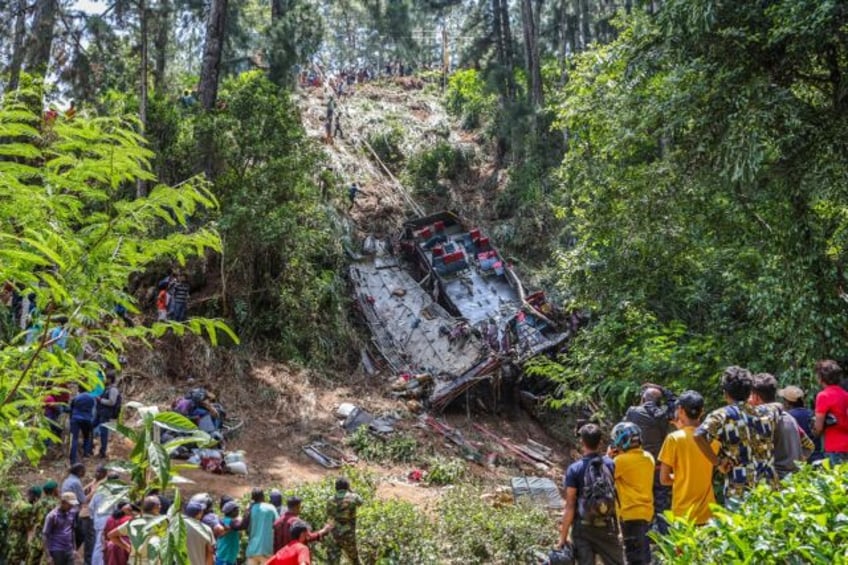 An overcrowded bus carrying dozens of Buddhist pilgrims plummeted into a precipice in Sri