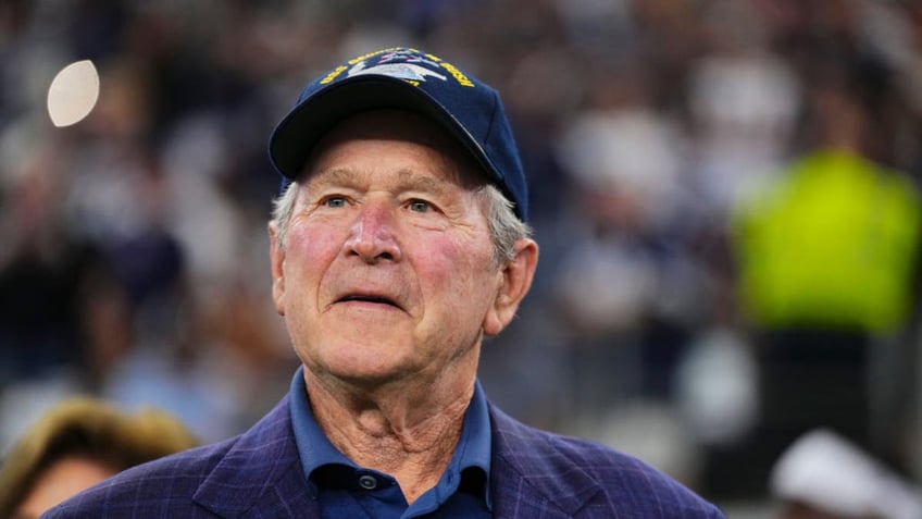 Former U.S. President George W. Bush looks on before kickoff between the Dallas Cowboys and New York Giants at AT&amp;T Stadium on November 12, 2023, in Arlington, Texas. (Photo by Cooper Neill/Getty Images)