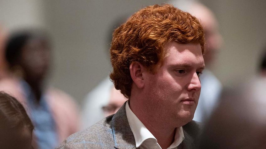 Buster Murdaugh stands in the courtroom after his father Alex Murdaugh is found guilty