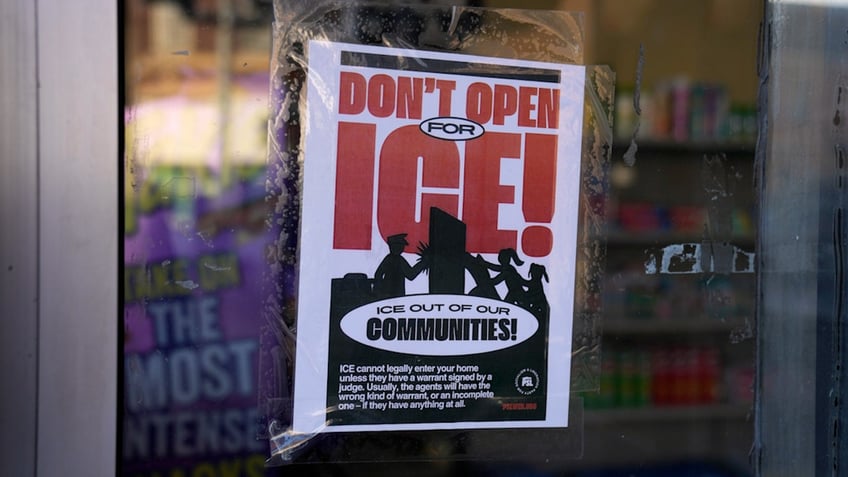 sign that says 'don't open for ICE'