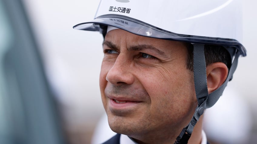 Transportation Sec. Pete Buttigieg, wearing a hard hat