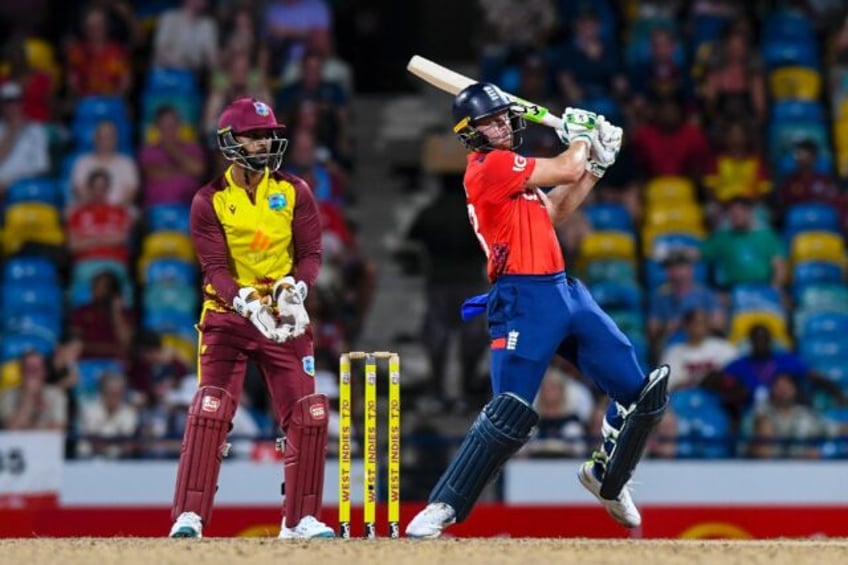 England captain Jos Buttler blasts a six to bring up his half-century in Sunday's win over