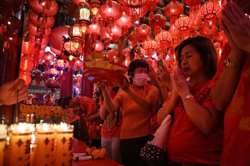 Millions of Thai-Chinese marked Lunar New Year with parties, family meals and visits to ma