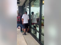 Bystanders outside Tennessee store trap alleged burglars inside, video shows