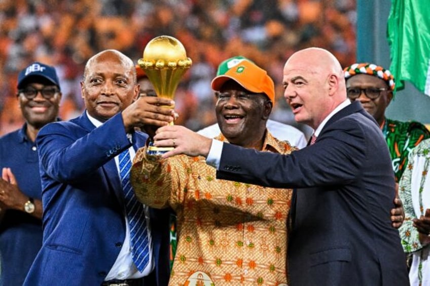 CAF president Patrice Motsepe (L), President Alassane Ouattara of the Ivory Coast and FIFA