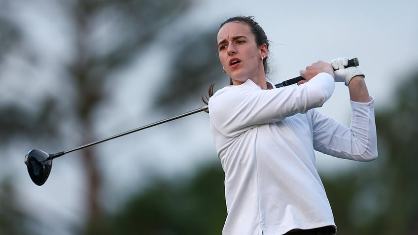 Clark tees off