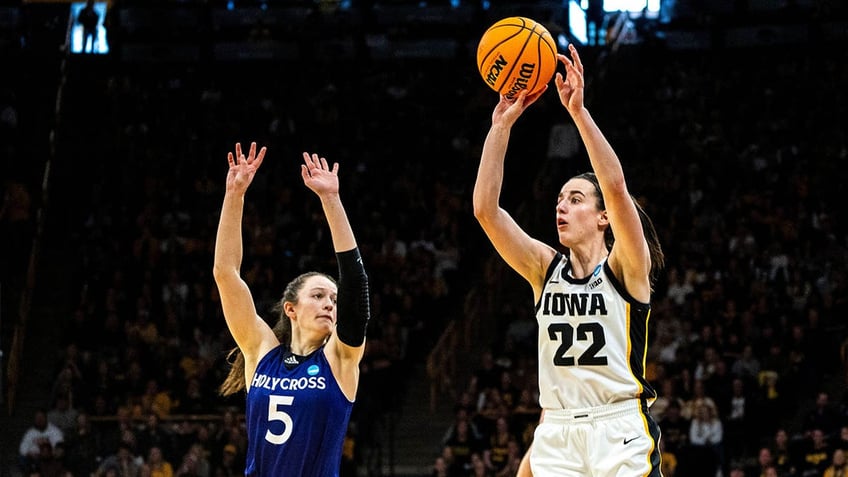 Caitlin Clark shoots the basketball