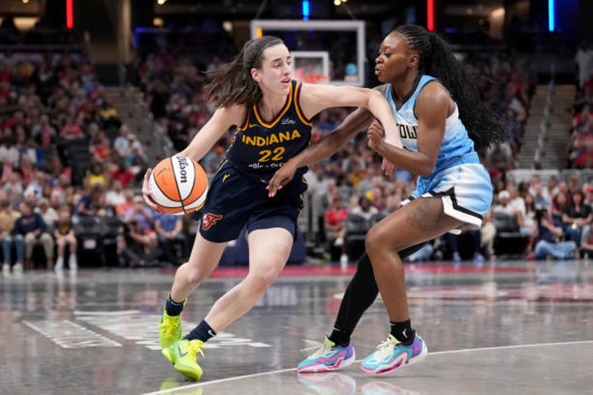 Caitlin Clark of the Indiana Fever drives the ball during a game against the Chicago Sky at Gainbridge Fieldhouse on June 16, 2024 in Indianapolis,...