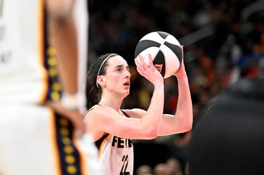 Caitlin Clark of the Indiana Fever shoots a free throw against the Washington Mystics at Capital One Arena on June 07, 2024 in Washington, DC. NOTE...