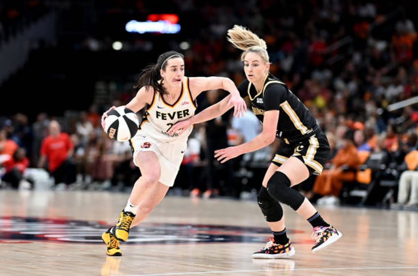 Caitlin Clark of the Indiana Fever handles the ball against Karlie Samuelson of the Washington Mystics at Capital One Arena on June 07, 2024 in...