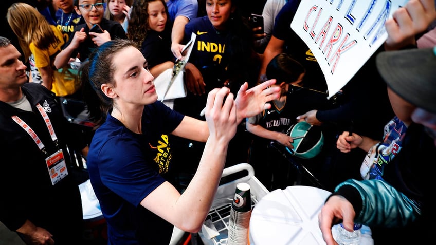 Caitlin Clark signs autographs