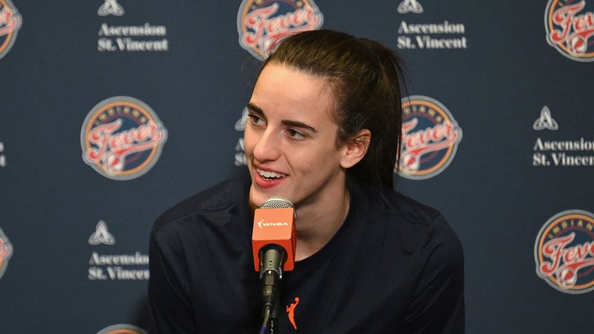 Caitlin Clark speaks during a press conference