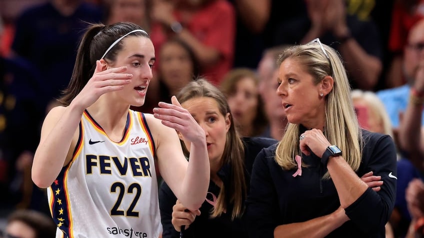 Caitlin Clark with her coach 