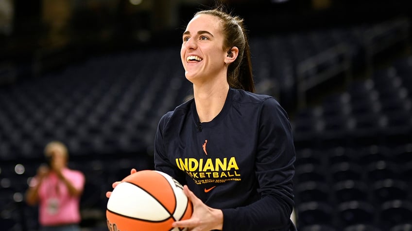 Caitlin Clark warms up before a game