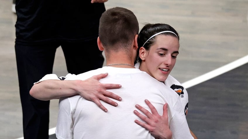 Indiana Fever guard Caitlin Clark hugs her boy friend Connor McCaffery