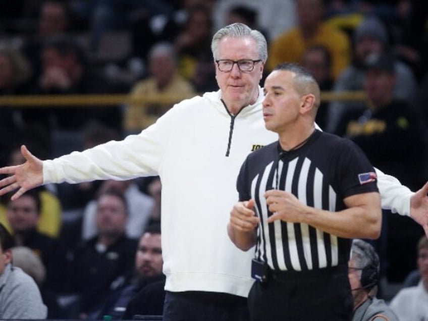 IOWA CITY, IOWA- FEBRUARY 19: Head coach Fran McCaffery of the Iowa Hawkeyes argues a cal