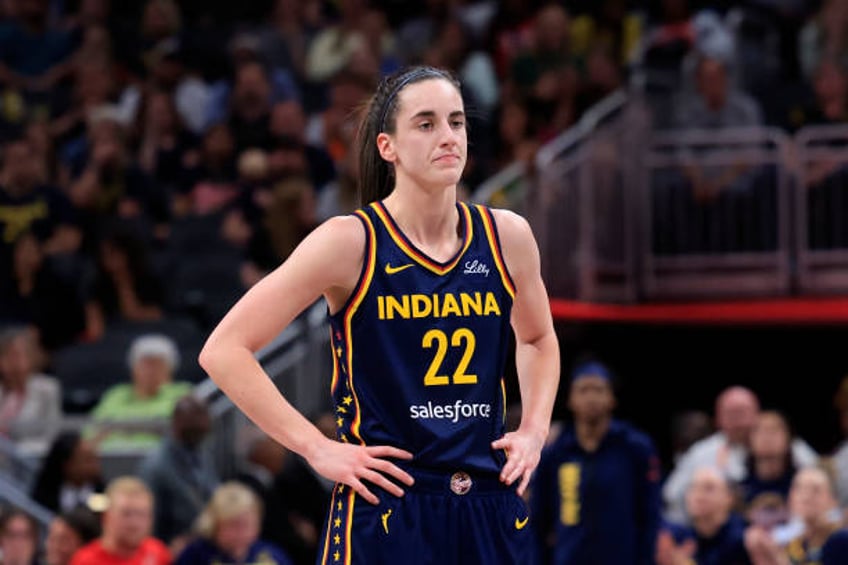 Caitlin Clark of the Indiana Fever looks on in the game against the Los Angeles Sparks at Gainbridge Fieldhouse on May 28, 2024 in Indianapolis,...