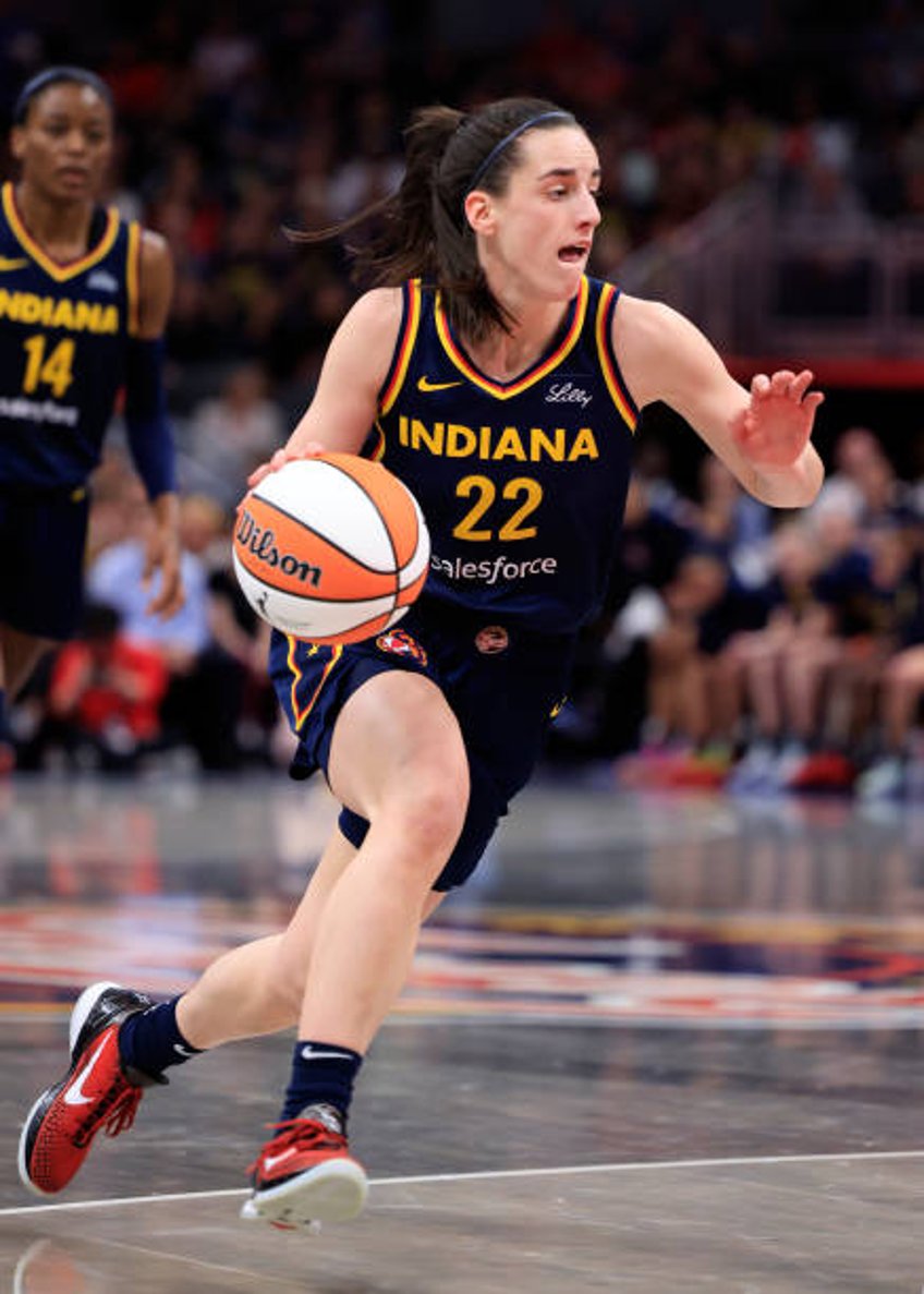 Caitlin Clark of the Indiana Fever drives to the basket against the Los Angeles Sparks at Gainbridge Fieldhouse on May 28, 2024 in Indianapolis,...