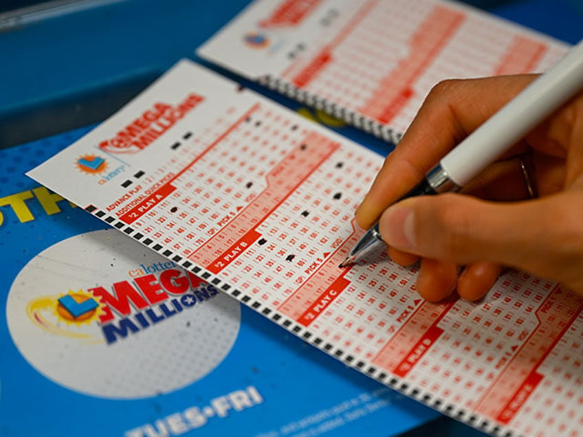 A person plays lottery at a 7-eleven store as Mega Millions jackpot reaches $ 1 billion 58