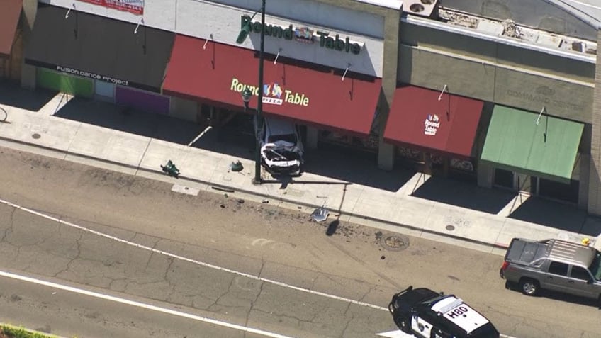 california car slams into pizzeria after road rage shooting incident police