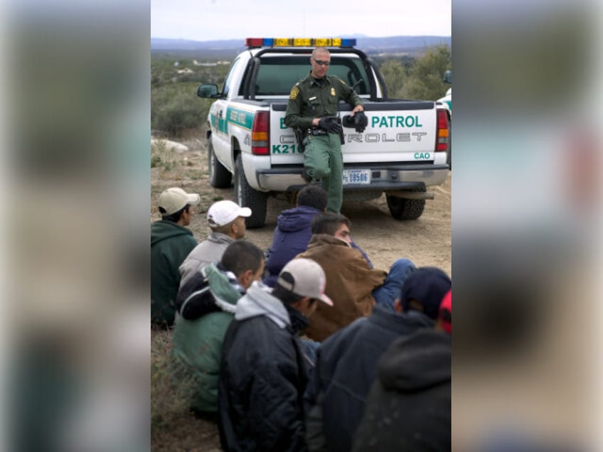 Mexican nationals who illegally crossed the California border are apprehended and handcuff