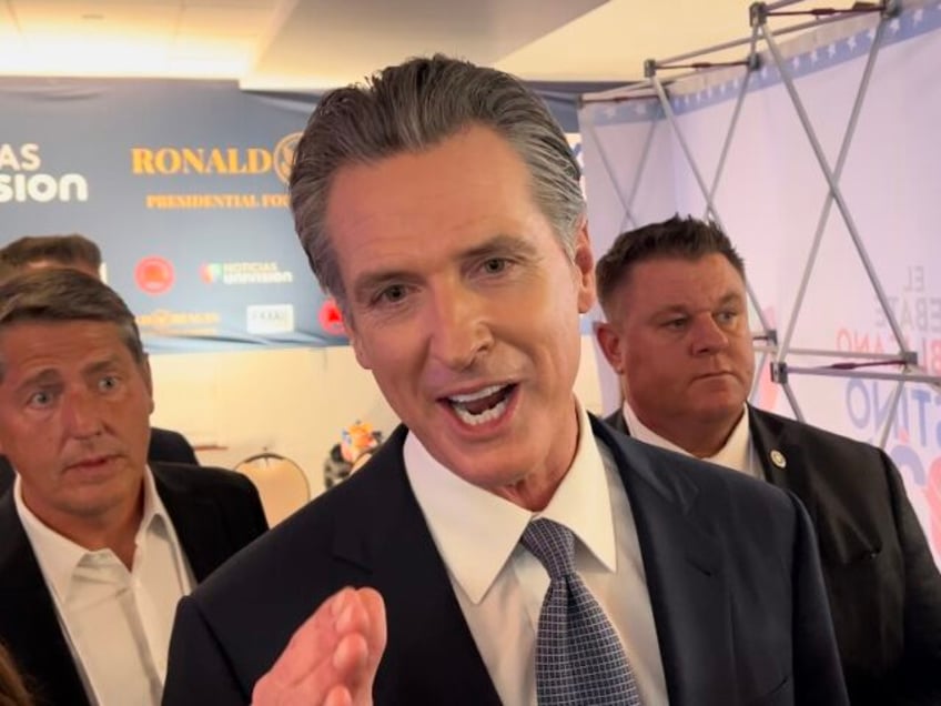 California Gov. Gavin Newsom (D) answers a question by Breitbart News' Joel B. Pollak