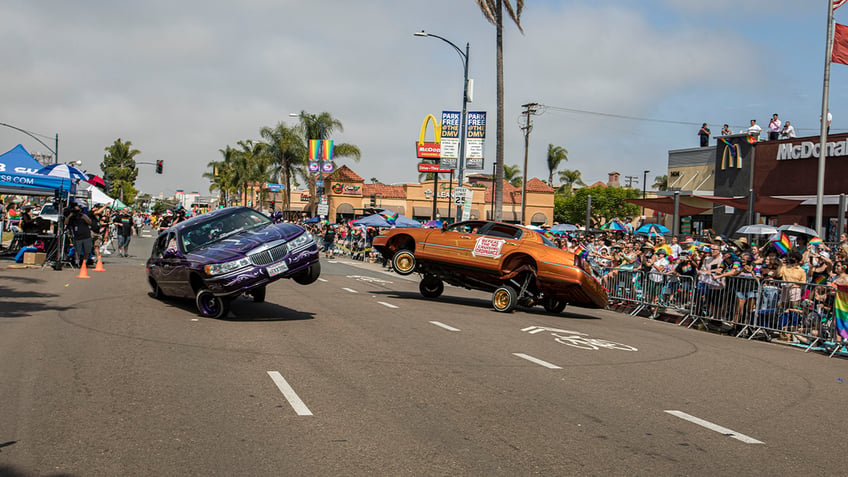 Lowriders on the street doing stunts