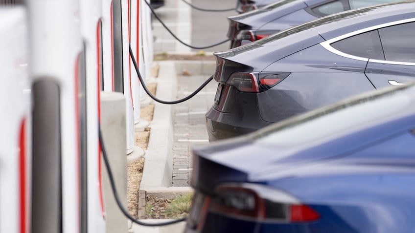 Tesla vehicles charge at a Tesla Supercharger station in Santa Monica, California, US, on Friday, Jan. 13, 2023. Tesla Inc. cut prices across its lineup in the US and major European markets in the carmakers latest effort to stoke demand after several quarters of disappointing deliveries. Photographer: Eric Thayer/Bloomberg