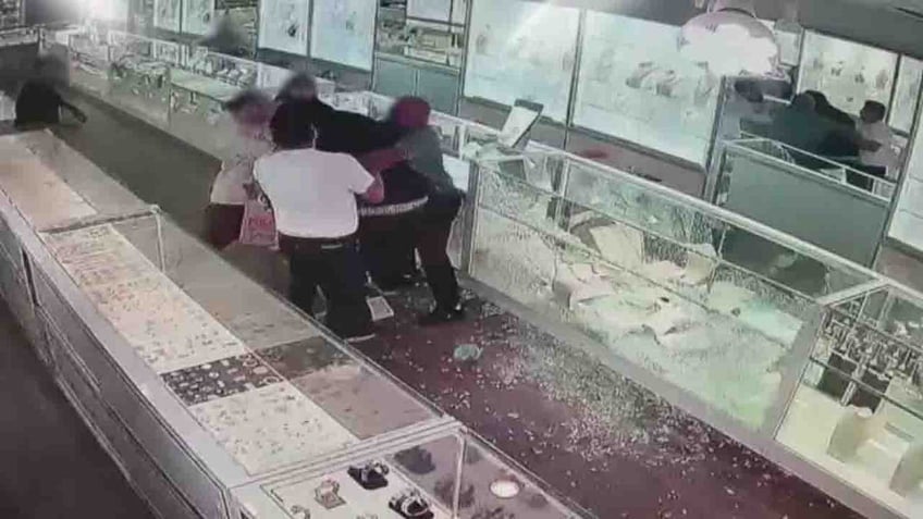 california jewelry store owners fight back during attempted smash and grab by suspect in trump mask