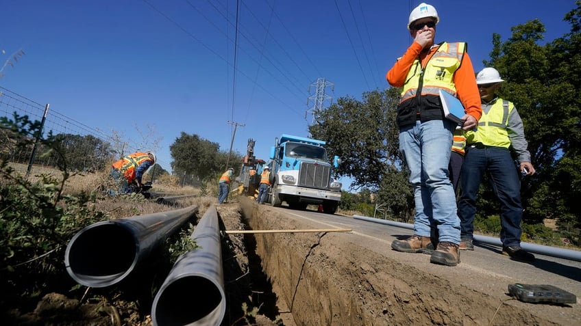A Pacific Gas and Electric crew buries power lines in Vacaville, California.