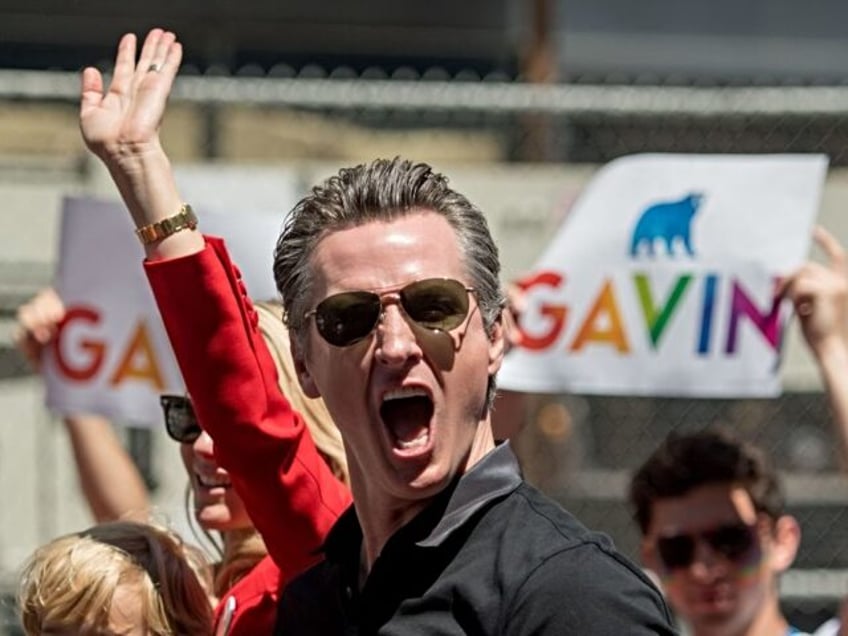 California gubernatorial candidate Gavin Newsom reacts to a cheering crowd during the San