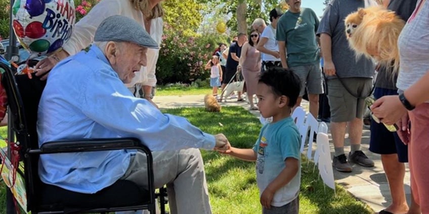 california man celebrates 100th birthday with dog parade featuring 200 pups of all shapes and sizes