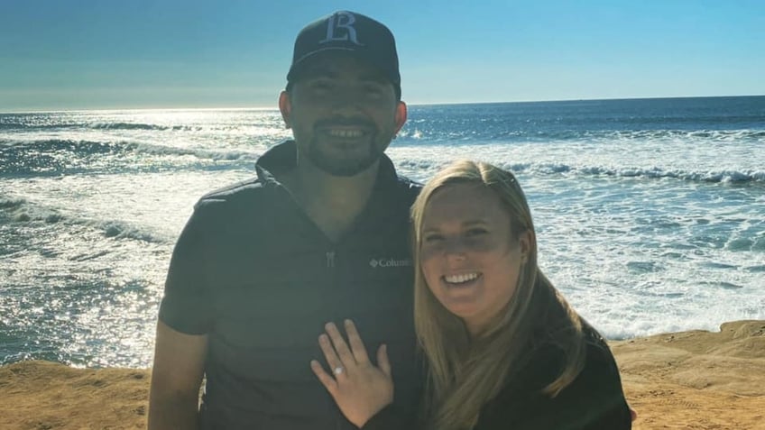 Mario Fierro and Amy Gembara posing after their engagement