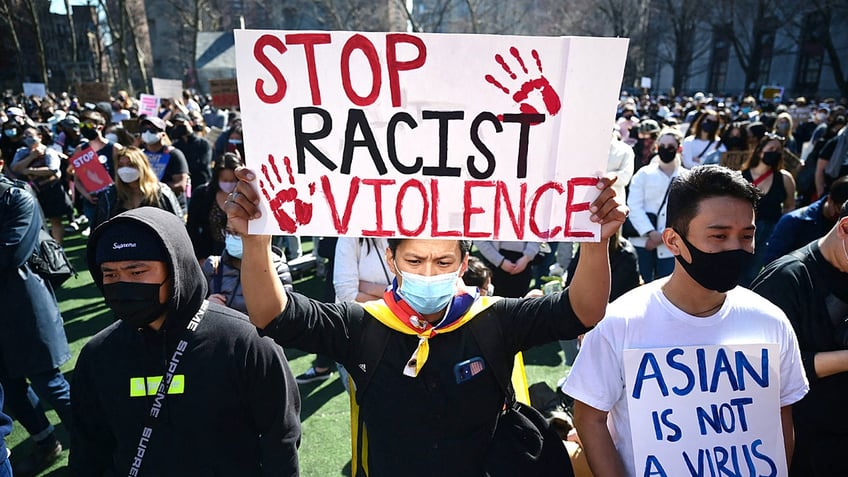 Protesters holding signs