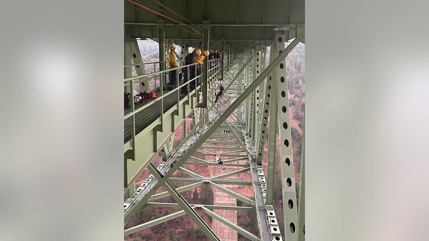 california sheriff releases image showing rescue of teen dangling 700 feet up on states highest bridge