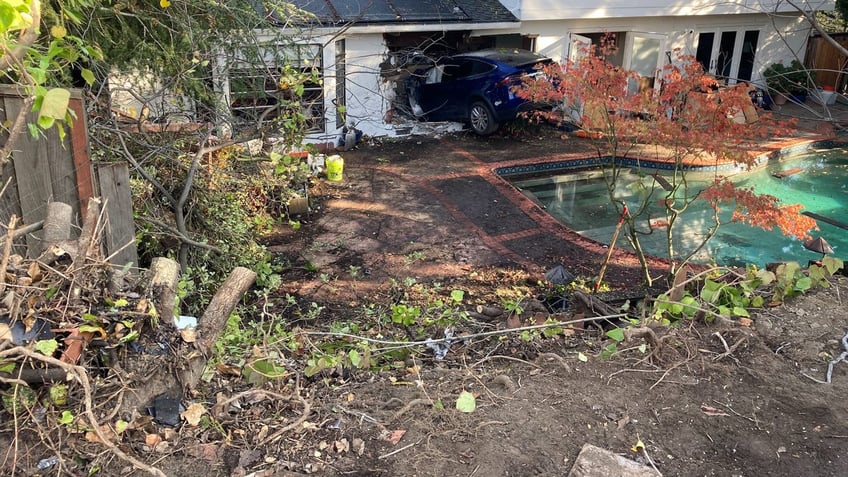 california tesla driver flies over pool crashes through house and stops in kitchen police say