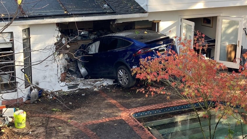 california tesla driver flies over pool crashes through house and stops in kitchen police say