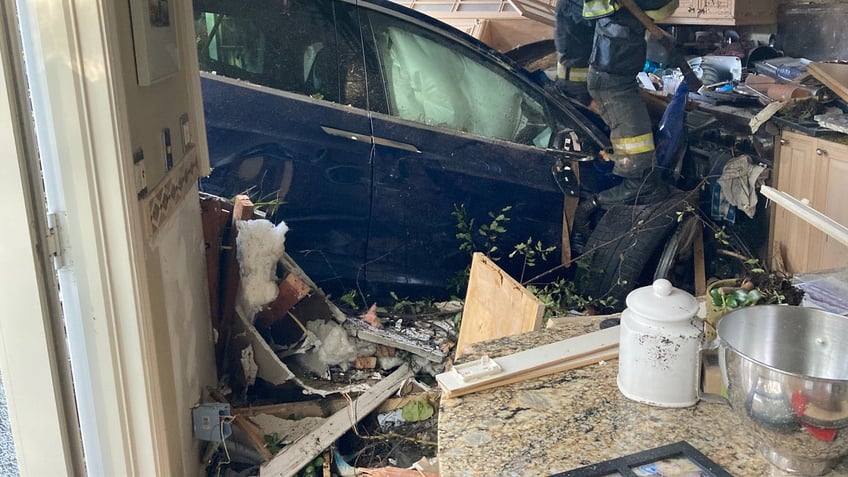 california tesla driver flies over pool crashes through house and stops in kitchen police say