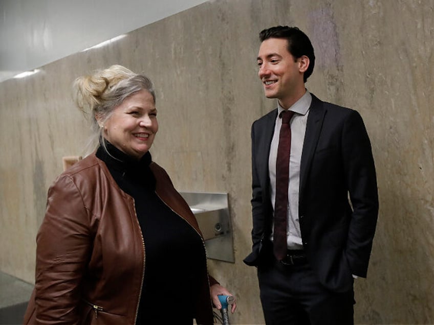 Sandra Merritt, left, smiles as she talks with David Daleiden outside of a courtroom in Sa