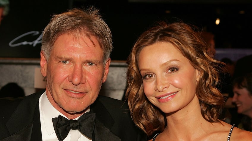 Actor Harrison Ford wears bowtie to awards ceremony with Calista Flockhart.