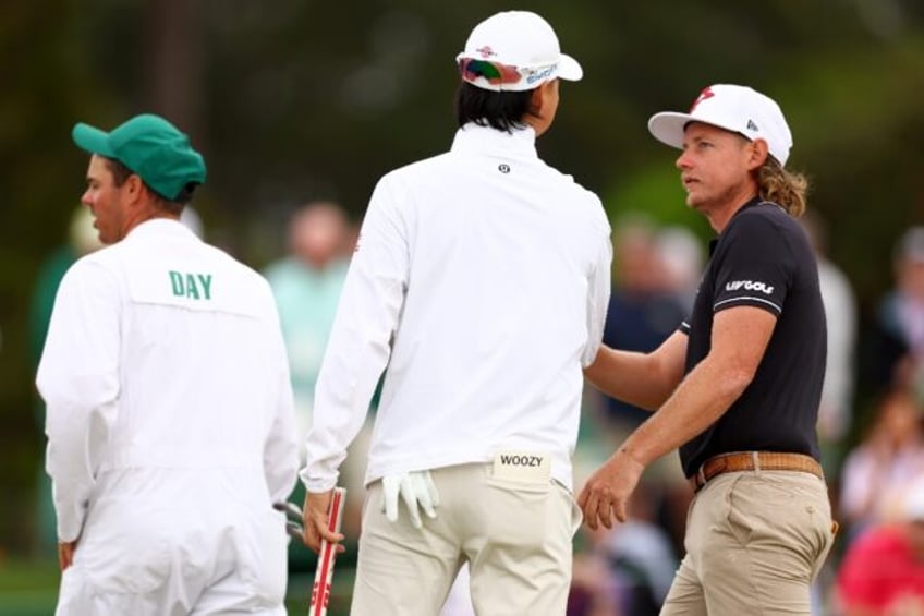 Min Woo Lee (left) and Cameron Smith of Australia chat during their practice round Tuesday