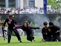 Cambodian students re-enact bloody Khmer Rouge crimes
