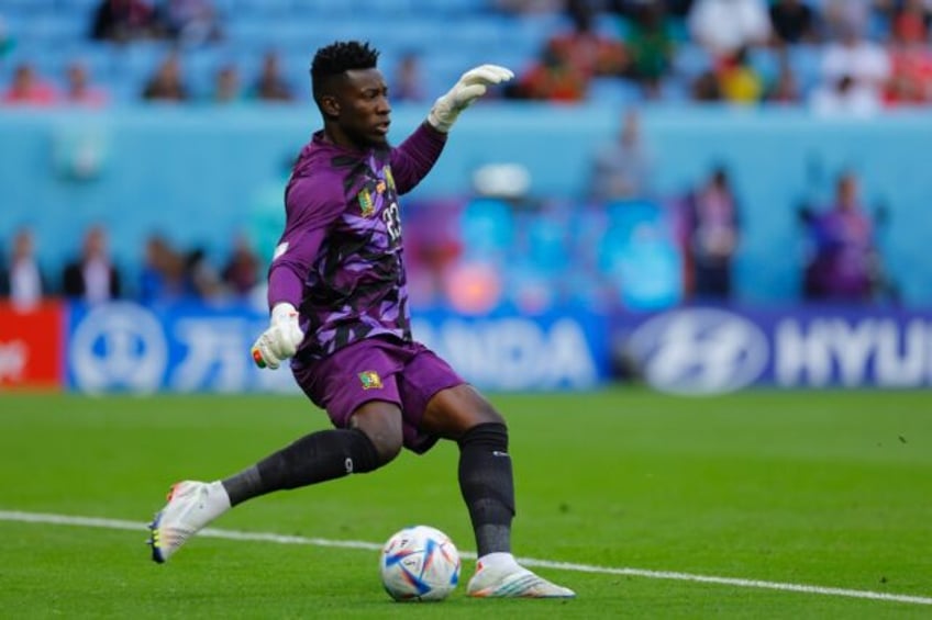 Cameroon goalkeeper Andre Onana clears the ball during a 2022 World Cup group match against Switzerland in Qatar.