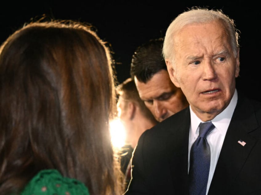 US President Joe Biden speaks to supporters gathered on the tarmac upon his arrival at Ral