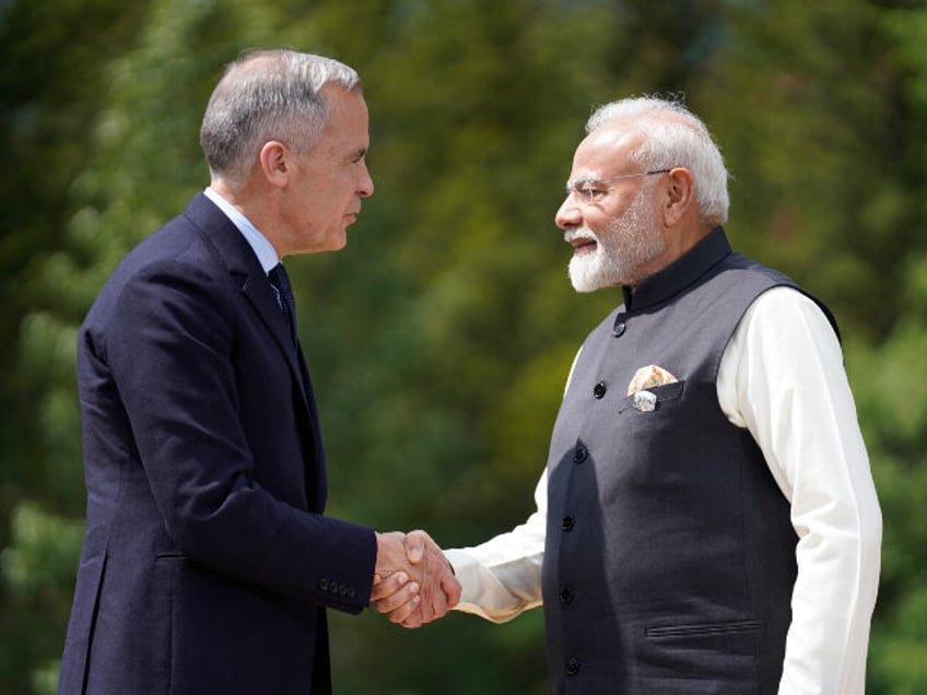 (L/R) Canadian Prime Minister Mark Carney greets Indian Prime Minister Narendra Modi befor