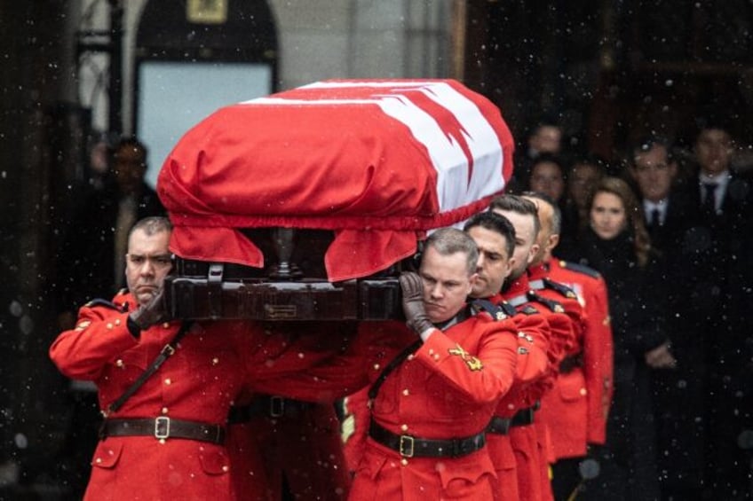 Pallbearers carry the casket of former Canadian prime minister Brian Mulroney following a